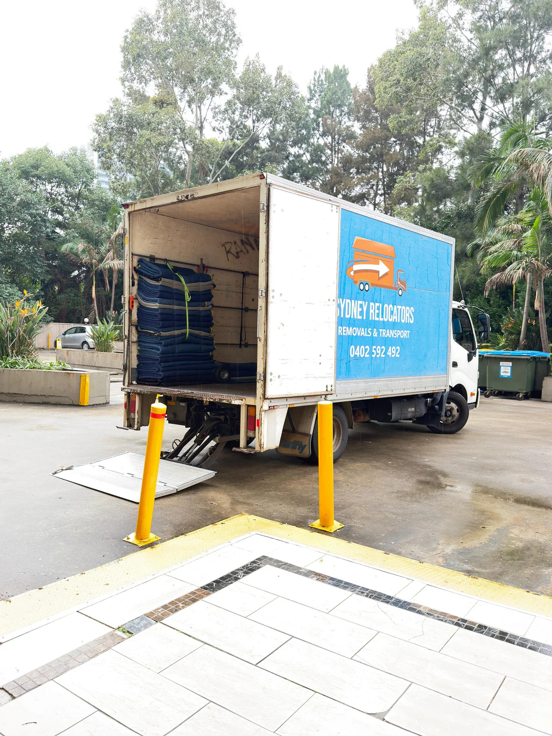 The truck backed in for a long carry from the street